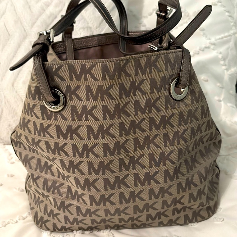 Michael Kors gray bag . Metallic gray leather straps